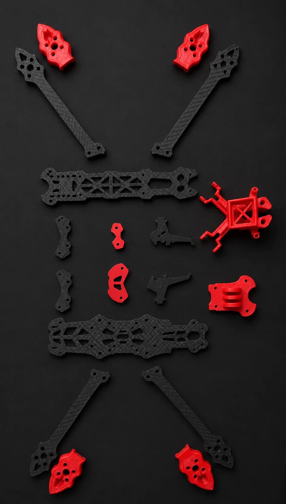 DronesZ 7-inch long-range FPV airframe, exploded flat-lay showing its extended carbon arms and standoffs.